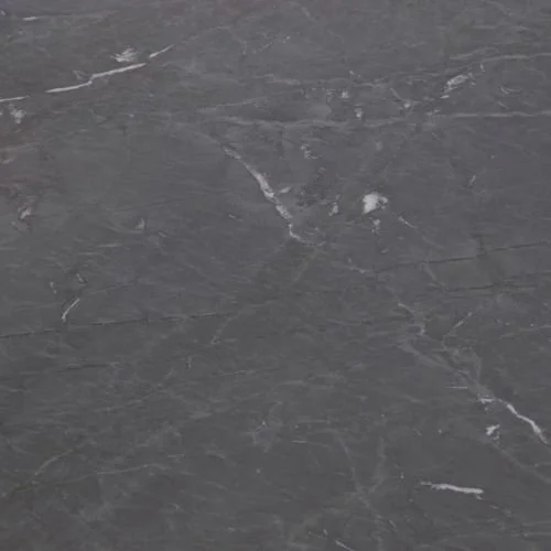 Close-up of a gray marble surface with white veining.