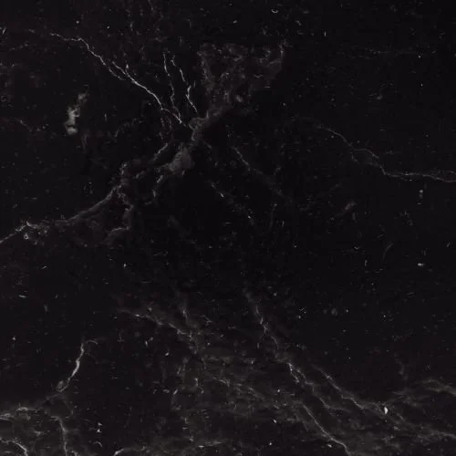Close-up of black marble with white veining.