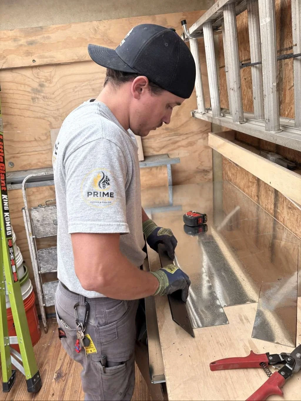 Technician Working On Sheet Metal