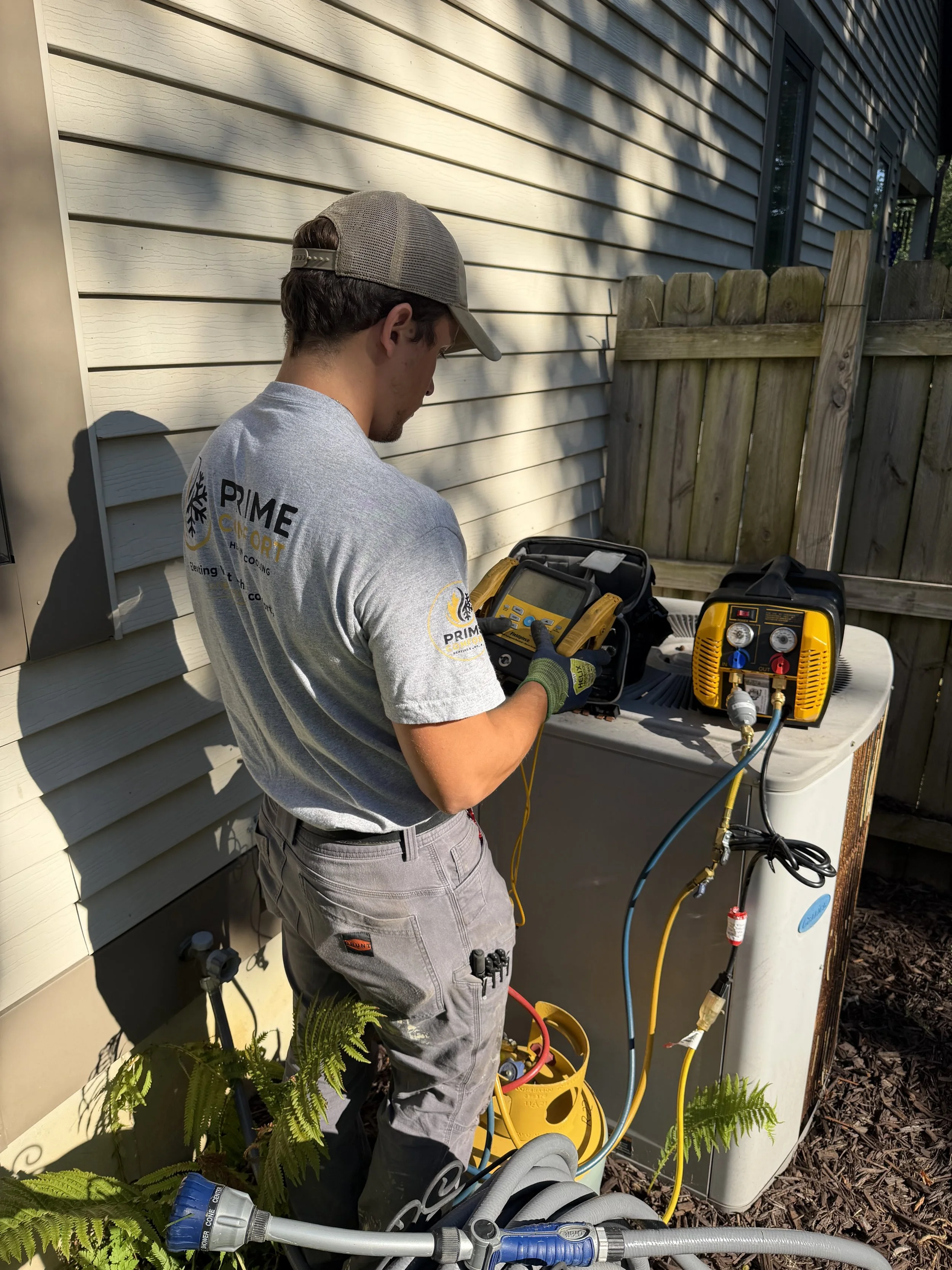 Technician performs maintenance on a system.