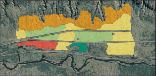 A color-coded map with various sections in orange, yellow, green, and red, overlaying snowy terrain with rock formations and a river at the bottom.