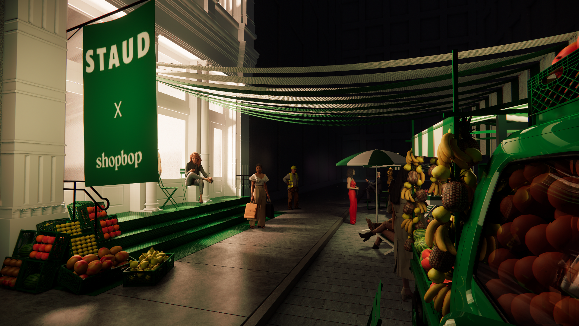 Indoor marketplace with a green sign reading 'STAUD X shopbop' and a fruit stand with bananas, apples, and other produce. Several people are sitting, standing, and shopping, with sunlight streaming through large windows.
