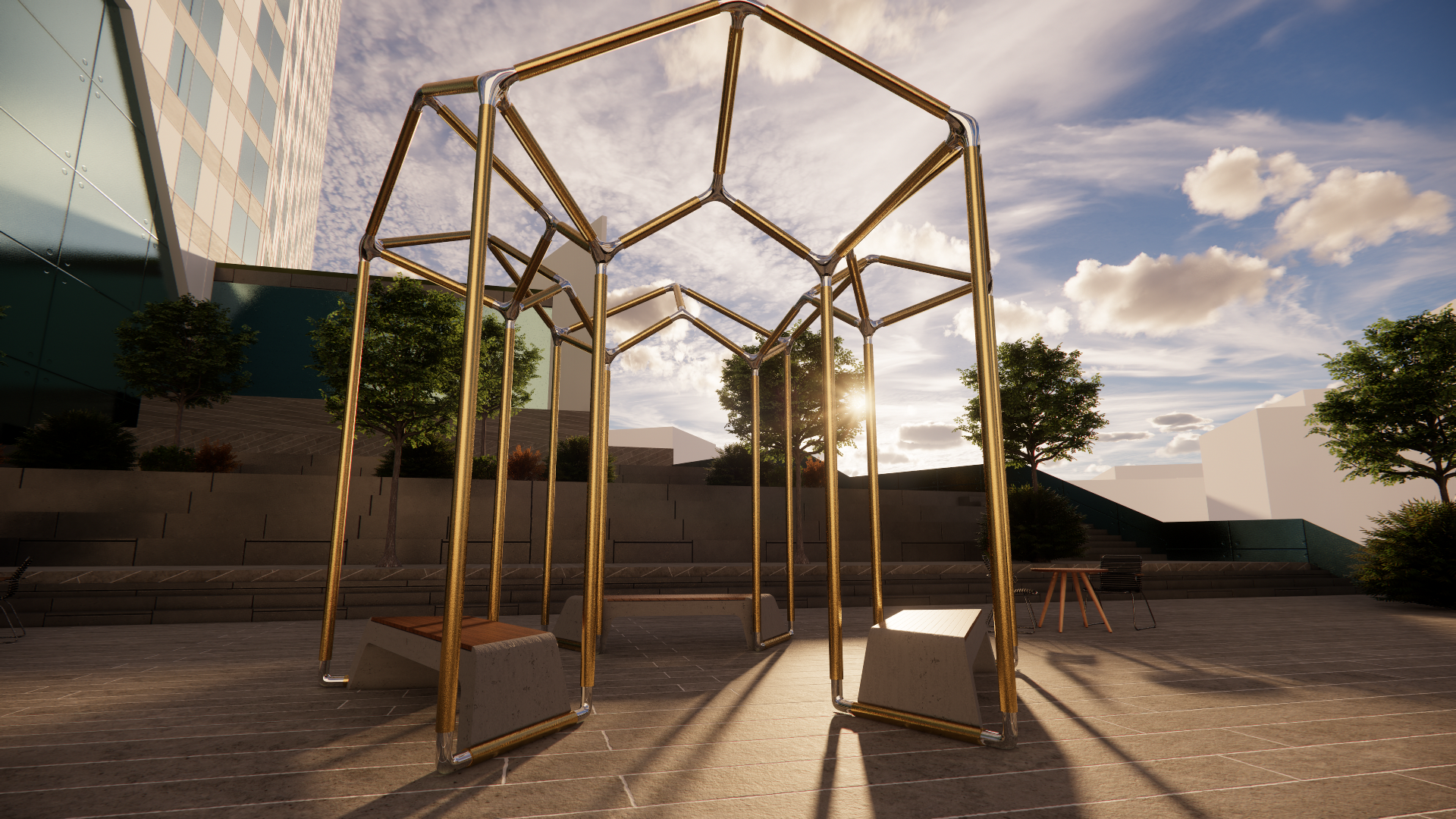Modern outdoor playground structure with climbing frames, situated in an urban area with trees, benches, and a building with reflective glass windows in the background, under a partly cloudy sky with sunlight.