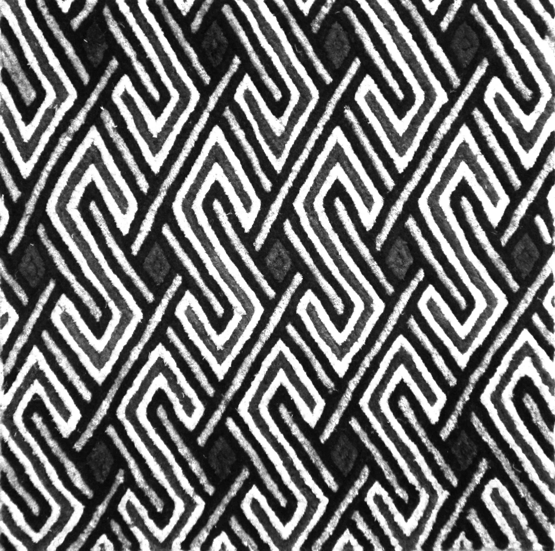 Black and white geometric pattern with diamond shapes and parallel lines.