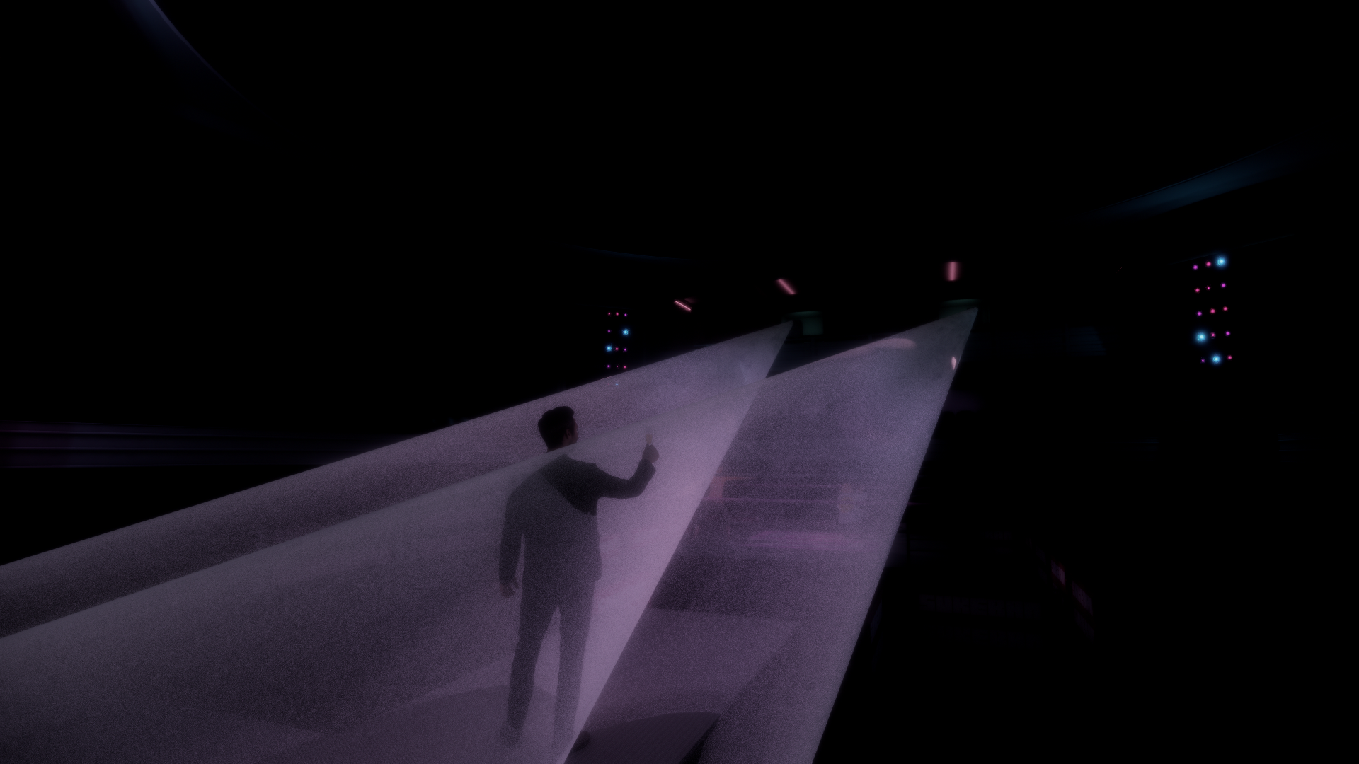 A person in a suit standing in a dark space, interacting with a semi-transparent screen or wall, illuminated by colored lights overhead.