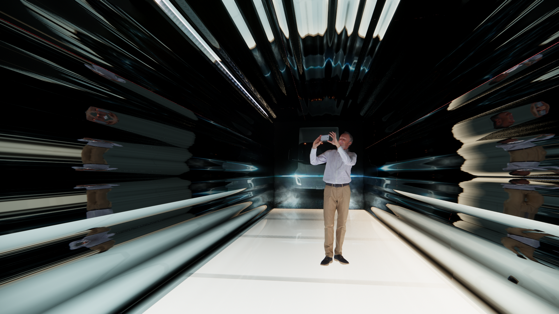 Person taking a photo inside a reflective, futuristic tunnel with distorted and elongated reflections of themselves and surroundings.