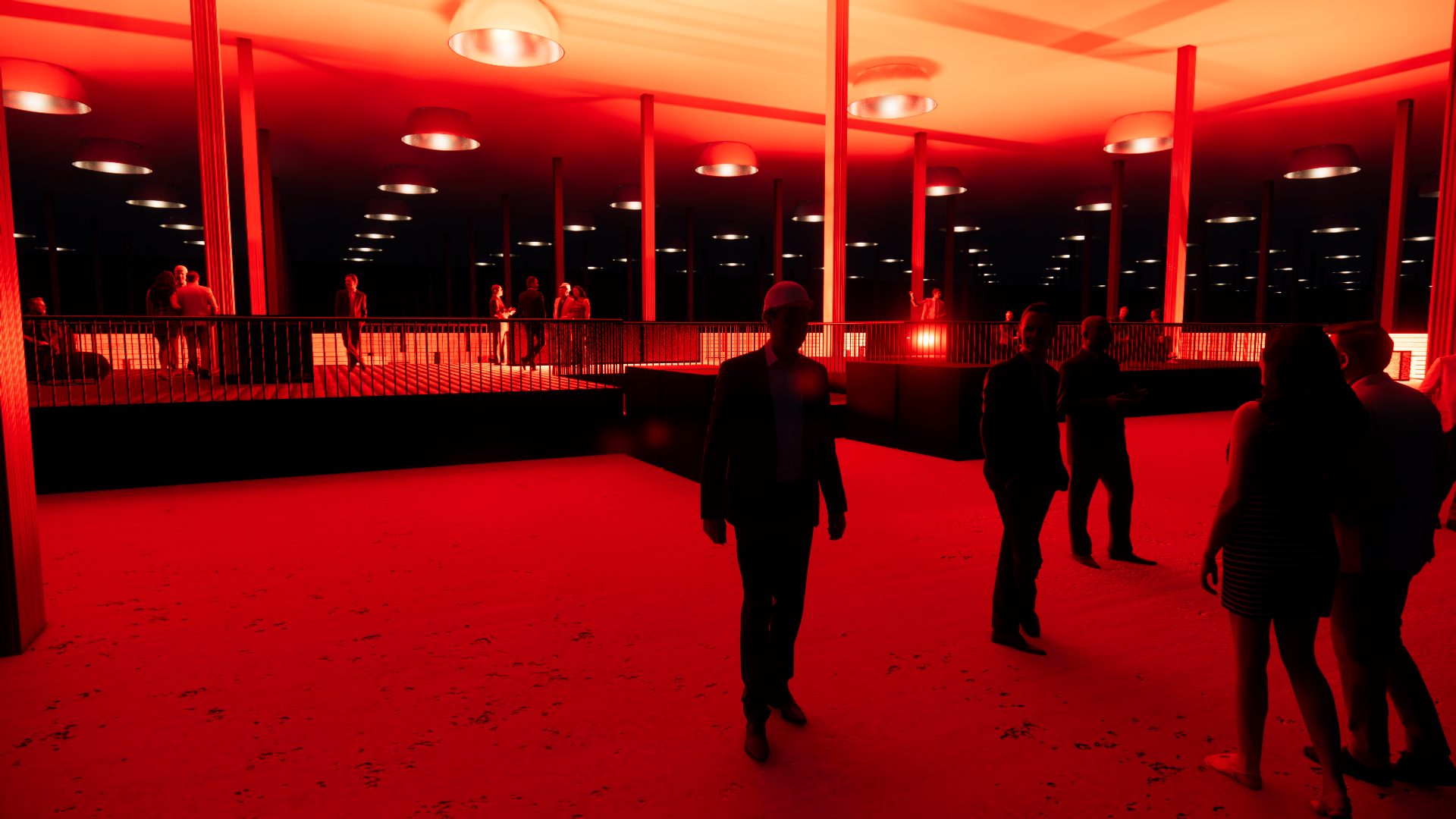 An interior scene of a modern building illuminated with red lighting and populated with people in formal attire, some wearing hard hats, engaged in conversations and walking around, with a balcony and ceiling lights visible.