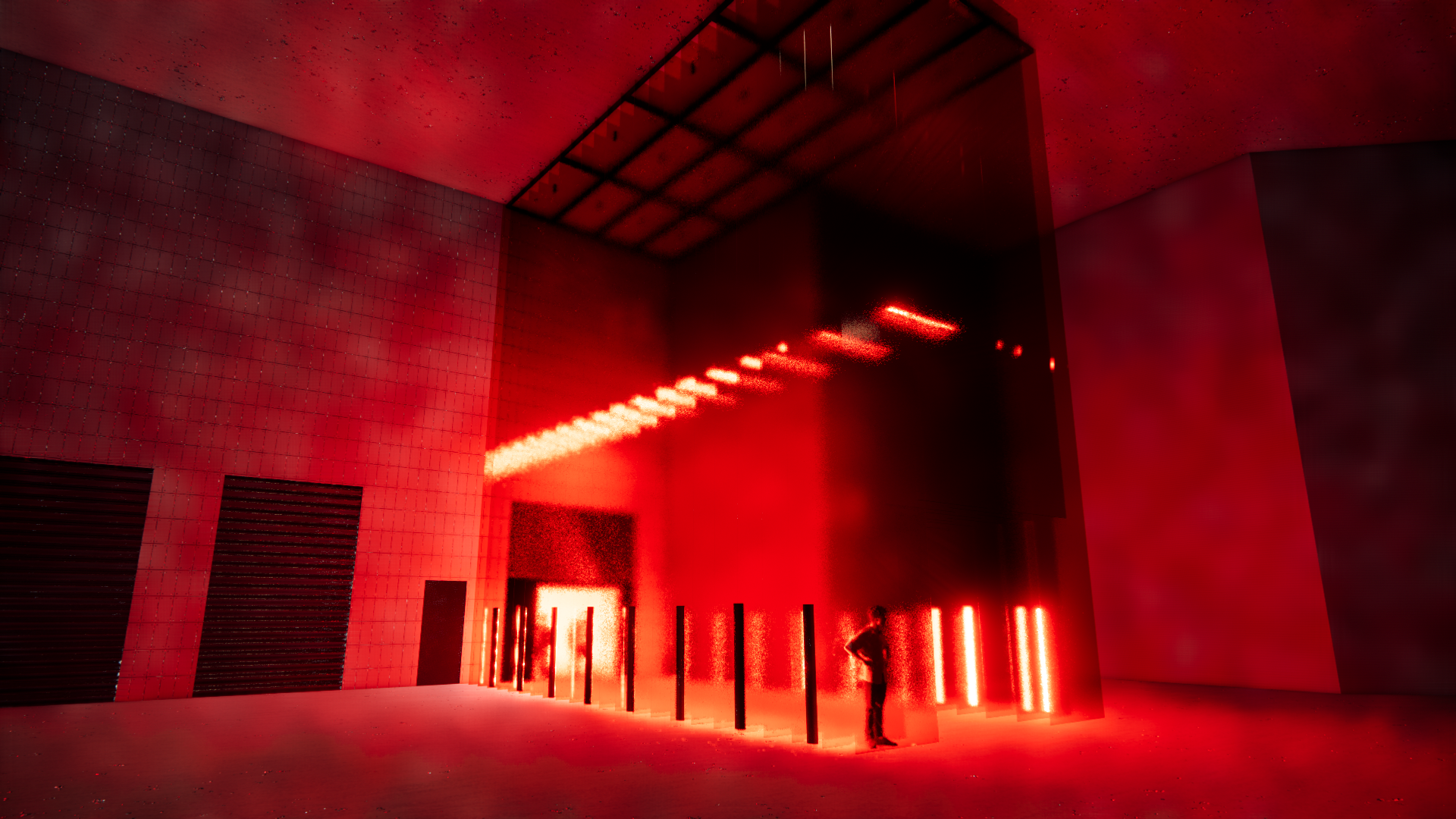 A large, dark room illuminated by vibrant red light. There are vertical light bars on the right side and a person standing near them, looking at the installation. The ceiling and walls have a modern, geometric design.