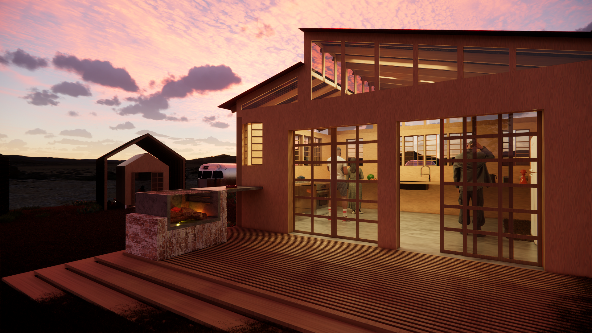 A modern house with large glass windows and a wooden deck overlooking a landscape at sunset. Inside, people are gathered around a kitchen island, with a fireplace outside on the deck.