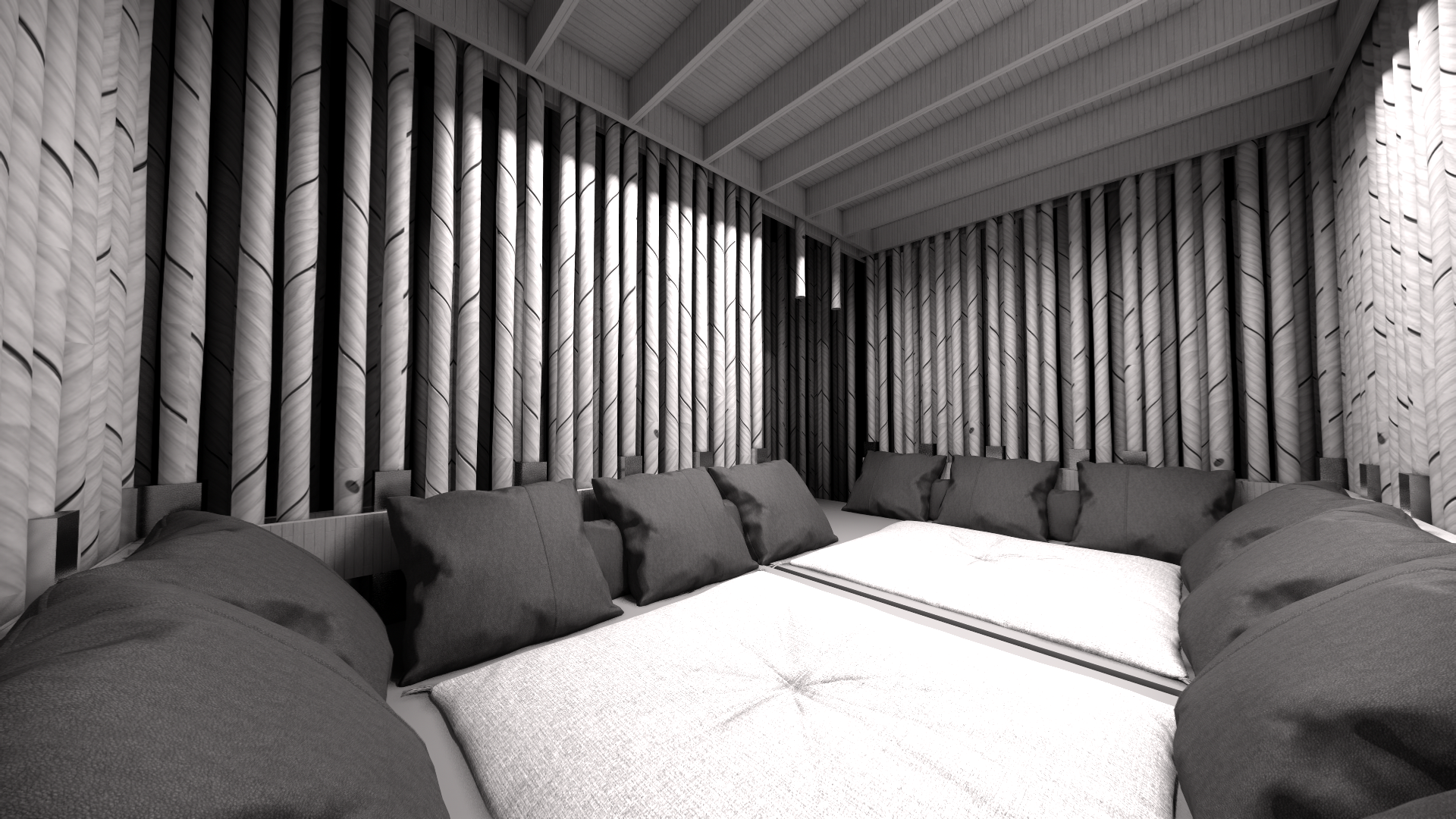 A cozy corner with a circular daybed with gray cushions and pillows, set against a textured black and white striped wall in a modern, minimalist room.