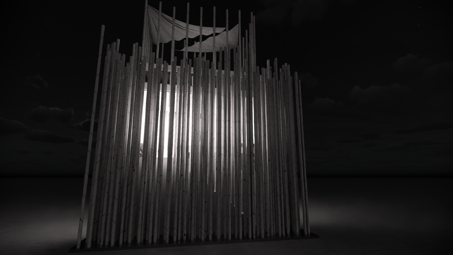 Nighttime photo of a modern art installation featuring vertical wooden poles arranged in a circular formation, with fabric-like material draped atop. Light shines through gaps between the poles, illuminating the installation against a dark sky with c