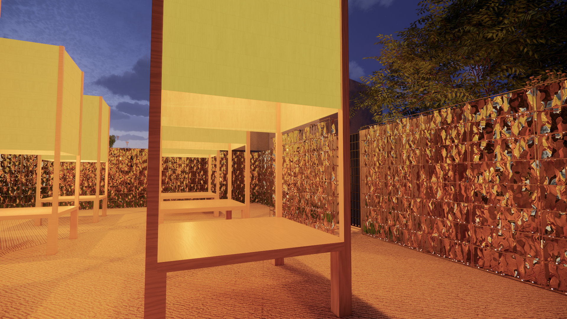 A modern outdoor space with wooden furniture, green and yellow walls, a colored fence, and trees, during dusk.