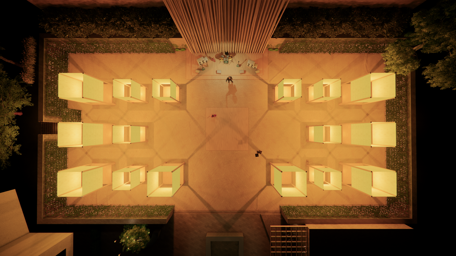 Bird's-eye view of an illuminated outdoor space at night with a stage at the top, surrounded by modern light fixtures, plants, and two people near the center.