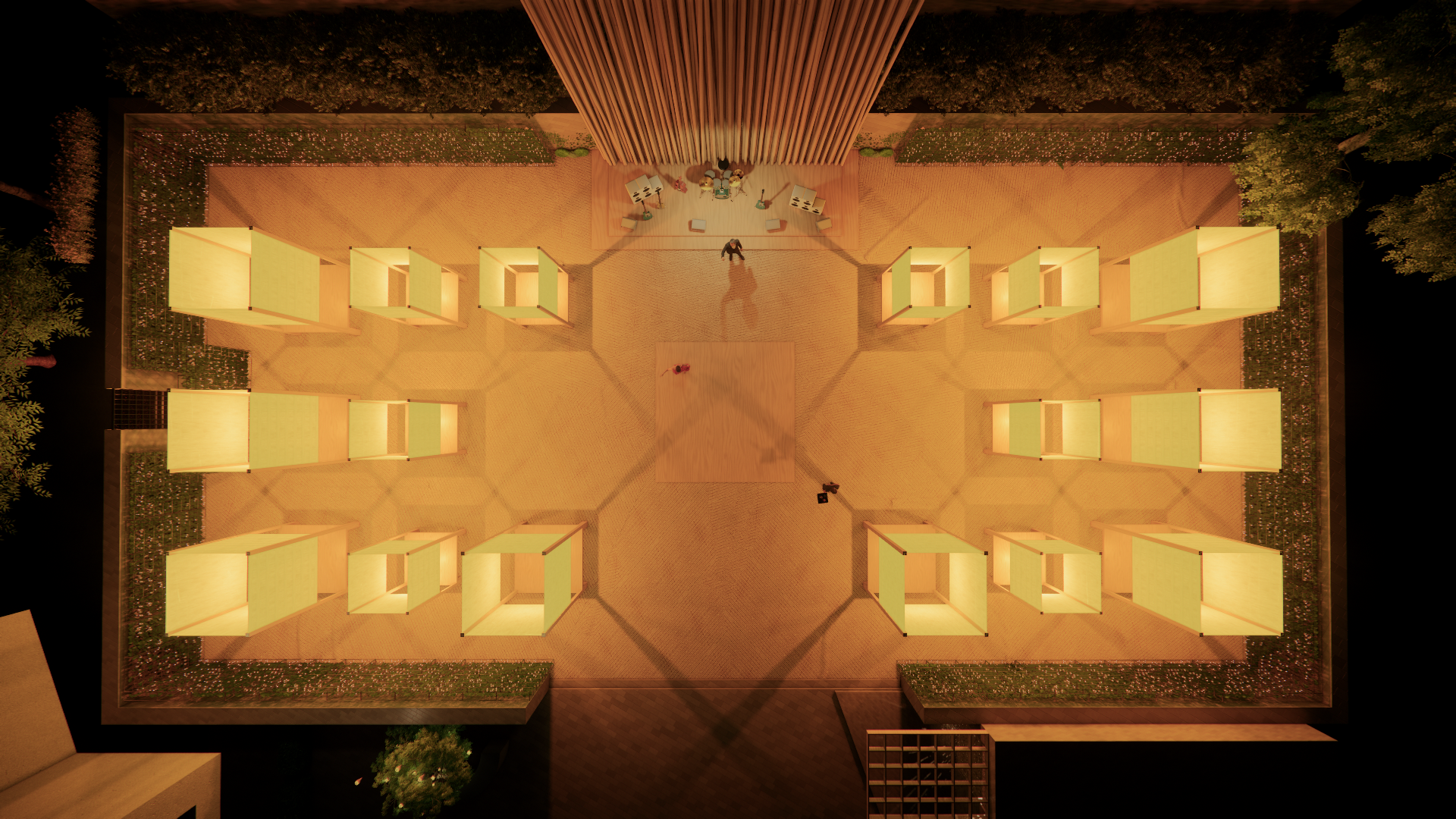 Aerial view of a modern outdoor lounge area at night with illuminated cubical structures arranged in a grid pattern, a stage with musical instruments at the top center, and a person standing in the middle.