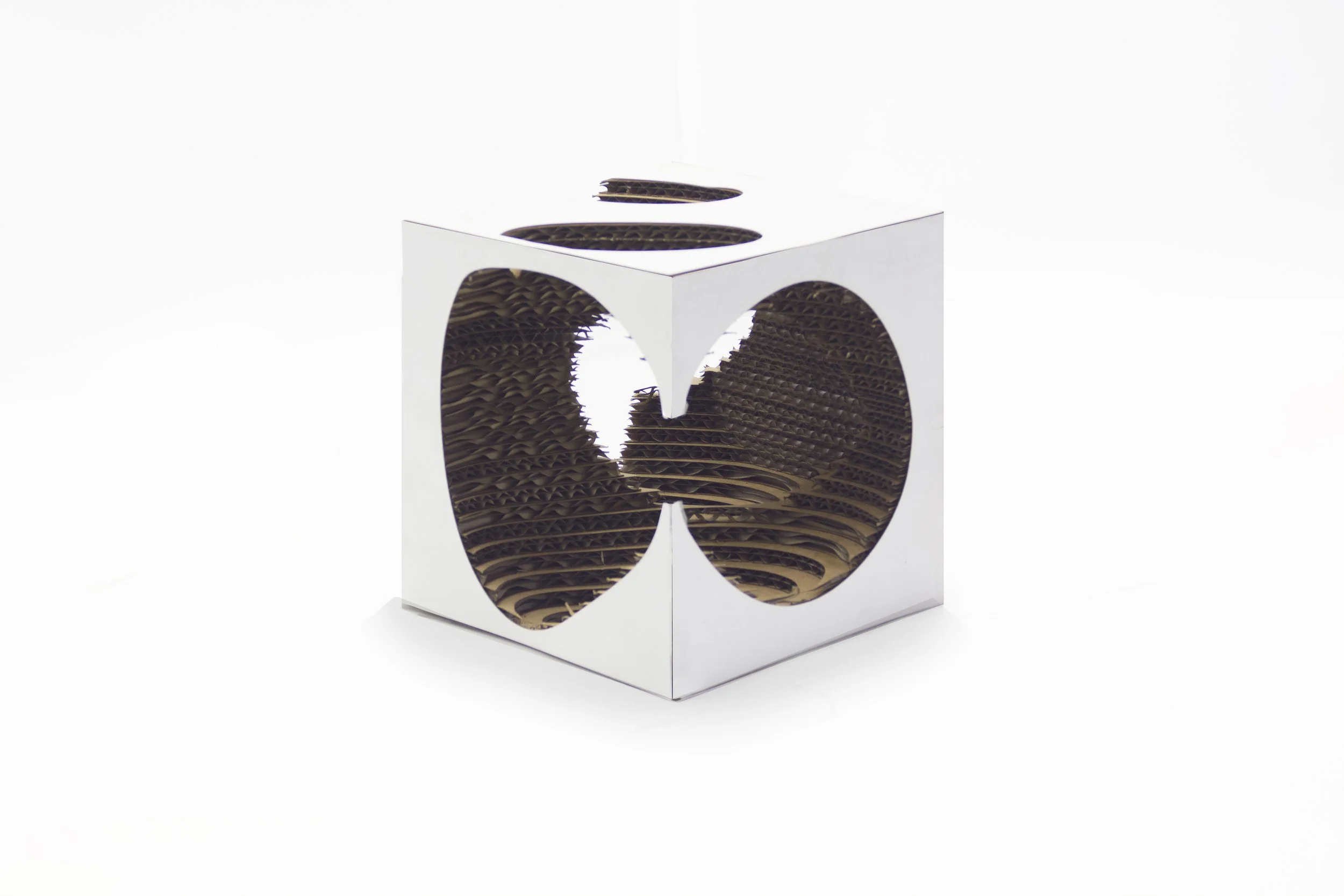 A cardboard display with cut-out images of apple slices, designed for retail presentation.