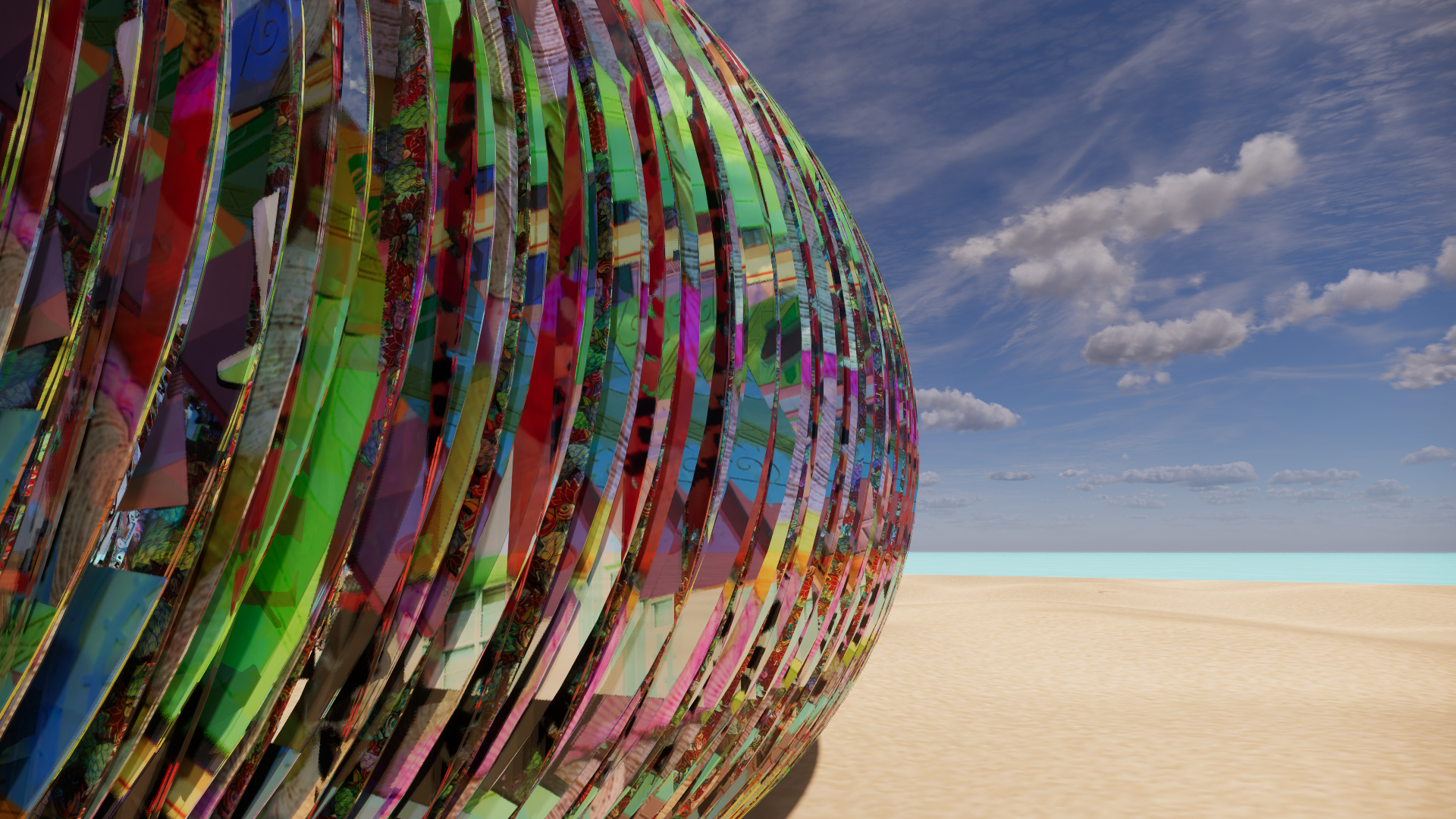 A large, spherical, glass sculpture with colorful, fragmented patterns, sitting on a sandy desert landscape under a partly cloudy sky.
