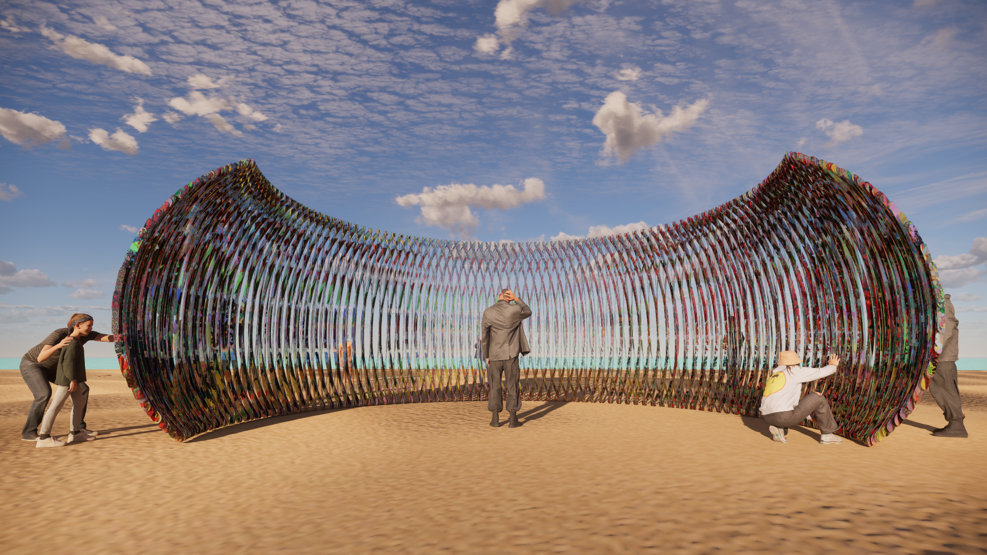 People gathered around a colorful, wave-shaped art installation on a sandy beach, with a partly cloudy sky above.