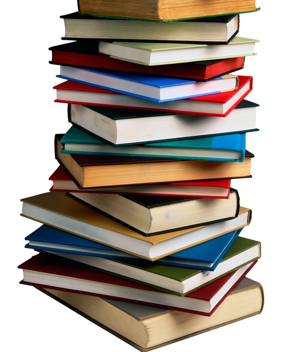 Stack of closed, colorful books that represents developmental editing for psychology books