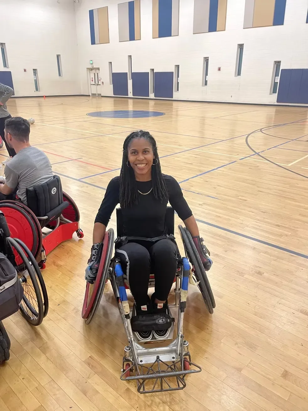 Tyree smiling on basketball court