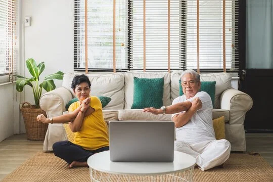 seniors doing yoga at home