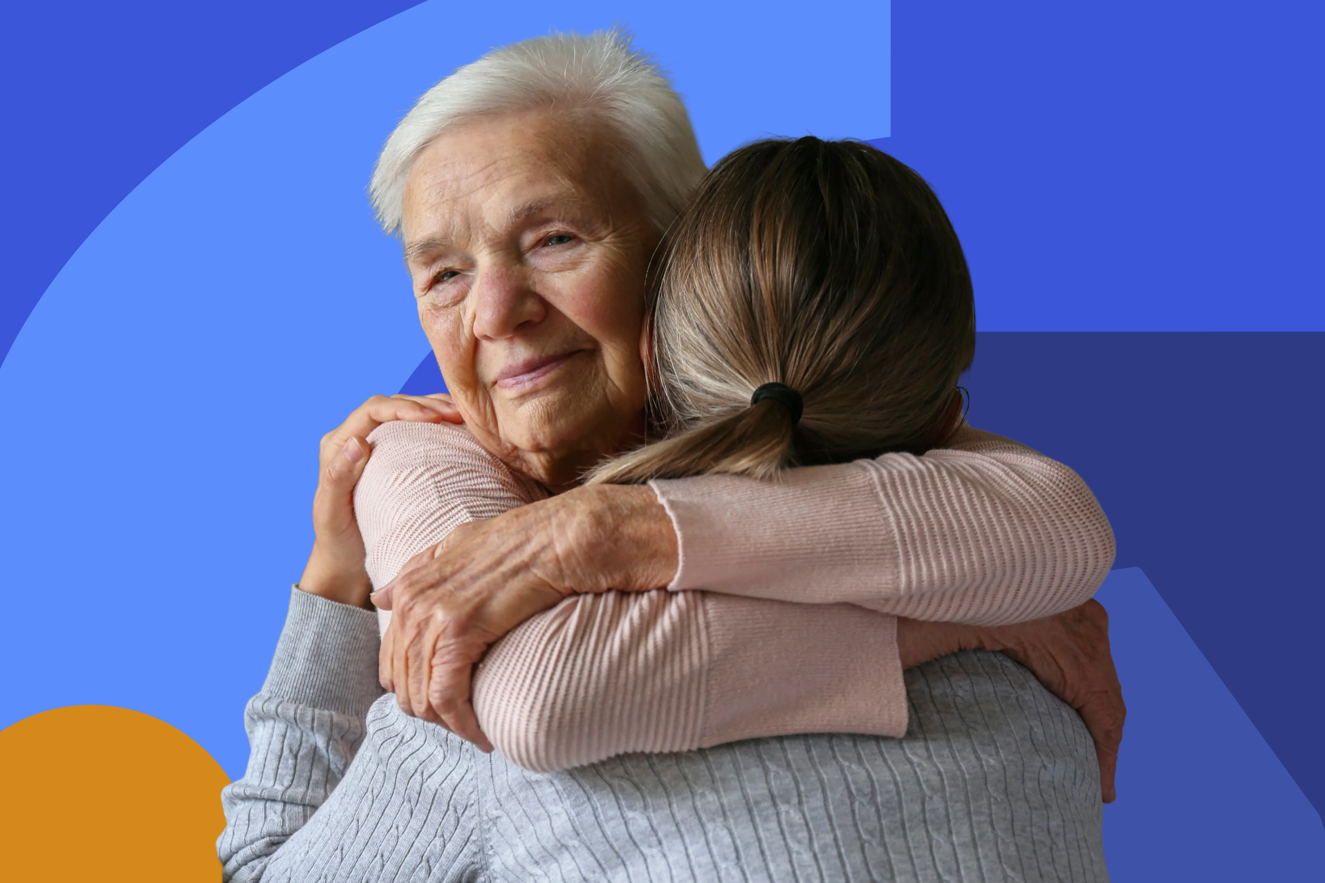 An older woman embraces a younger woman, representing the connection and support that help people with disabilities and their families thrive.