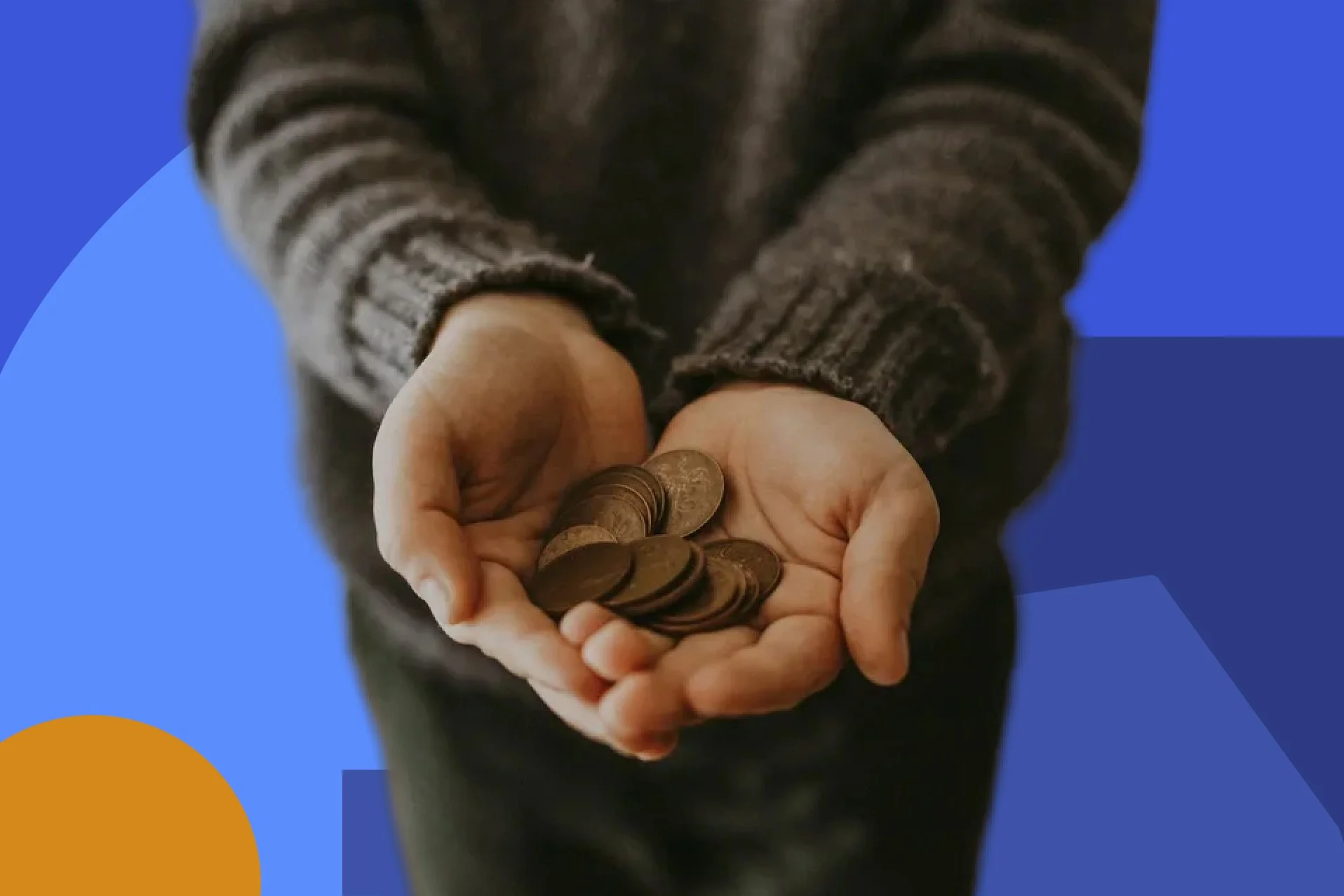 Close-up of a person holding several coins in their hands.