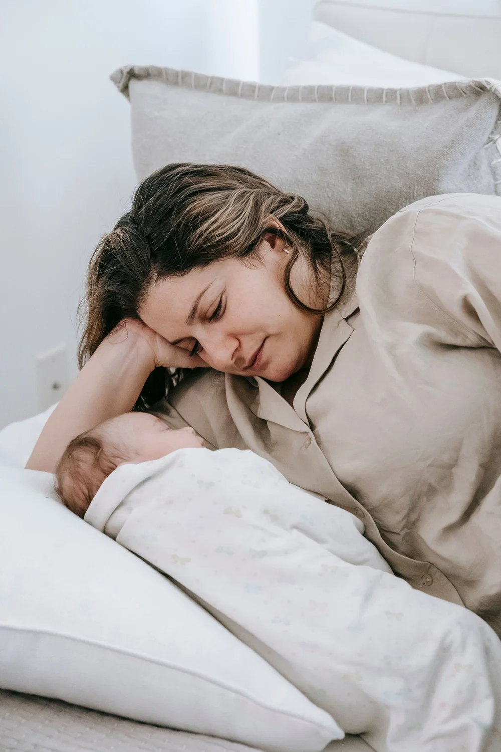 A mother resting with her baby