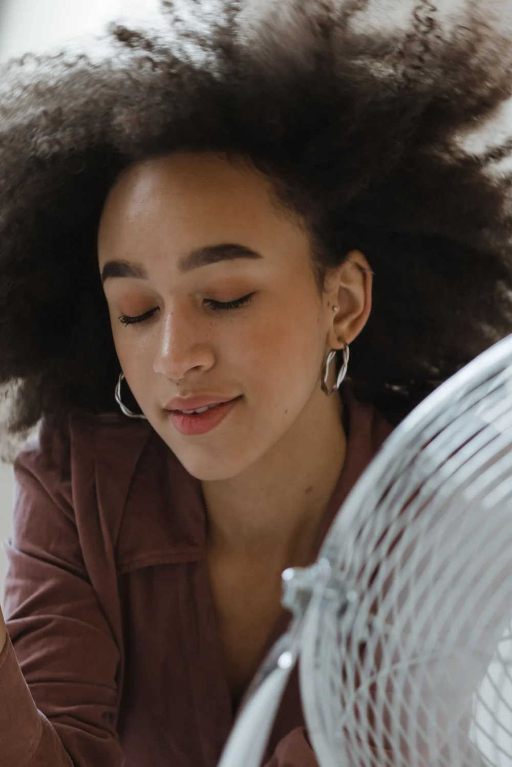 A woman resting with her eyes closed