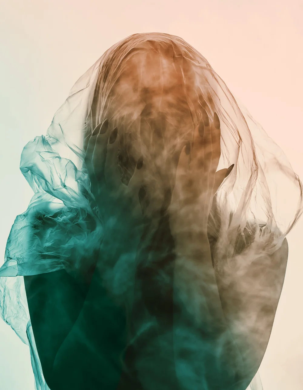 Teal smoke swirling against a soft background