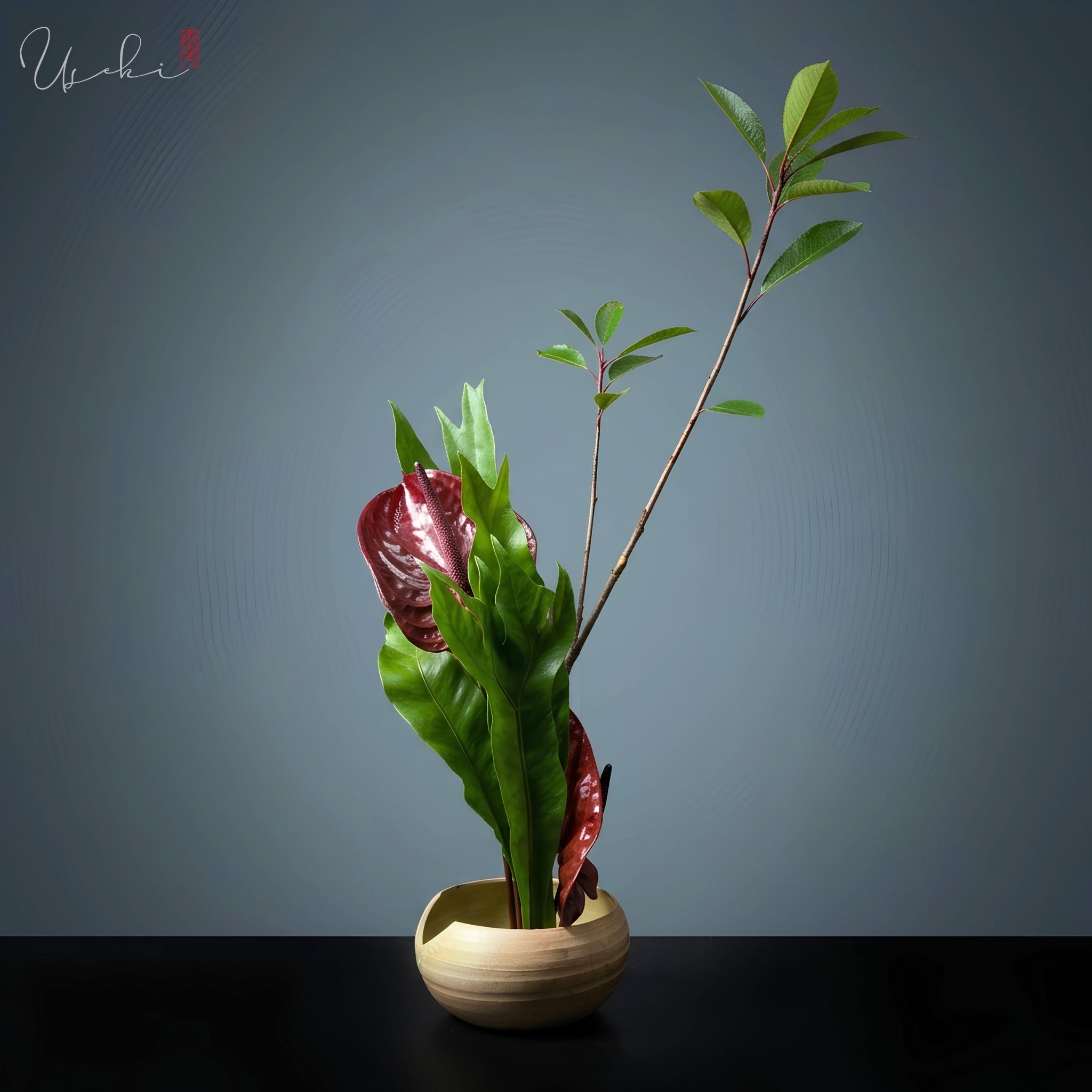 Sogetsu Ikebana upright classic line design featuring dark red calla lilies and slender branches