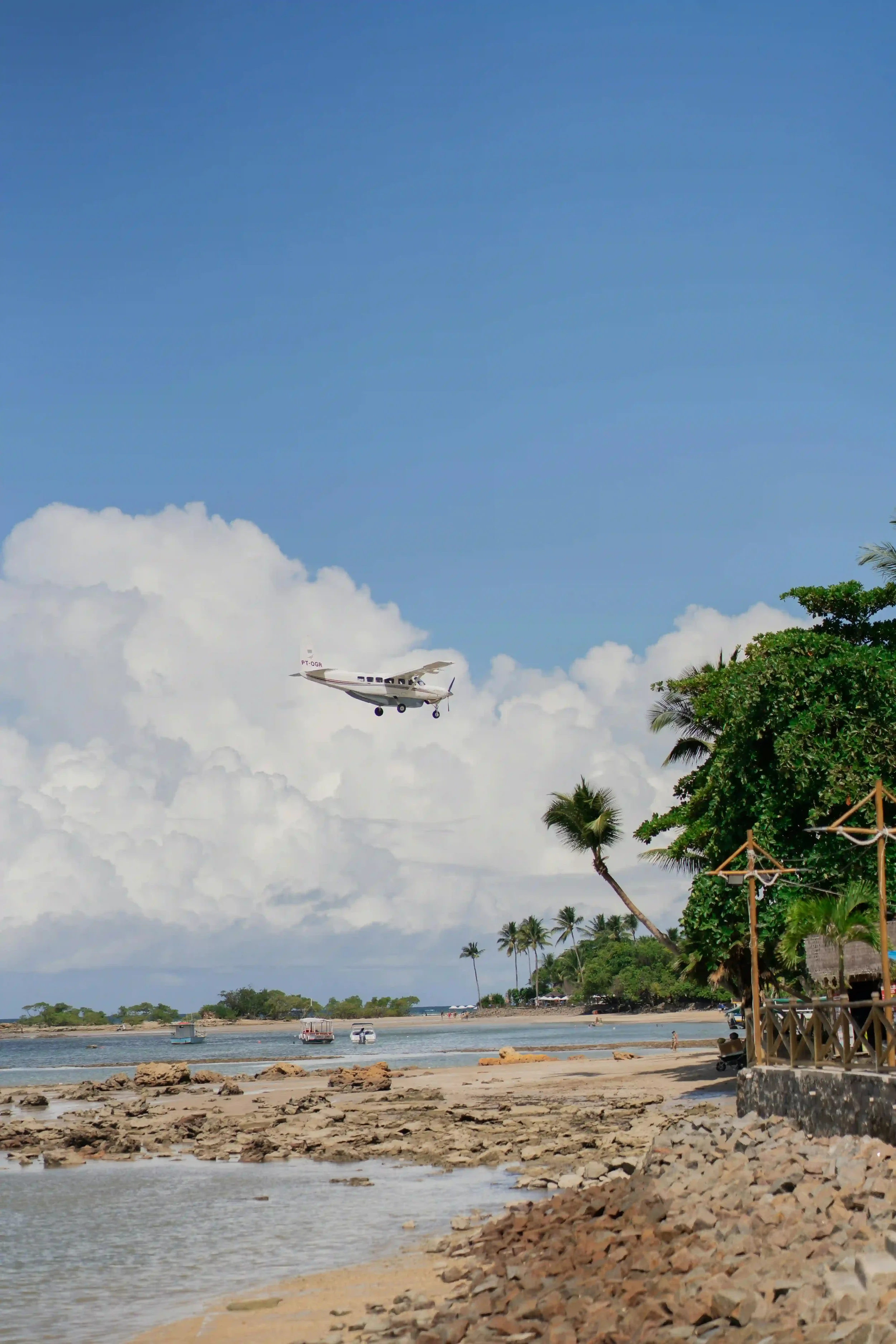 Aircraft arriving over Fiji island tropical coastline where all international arriving flights require aircraft disinsection