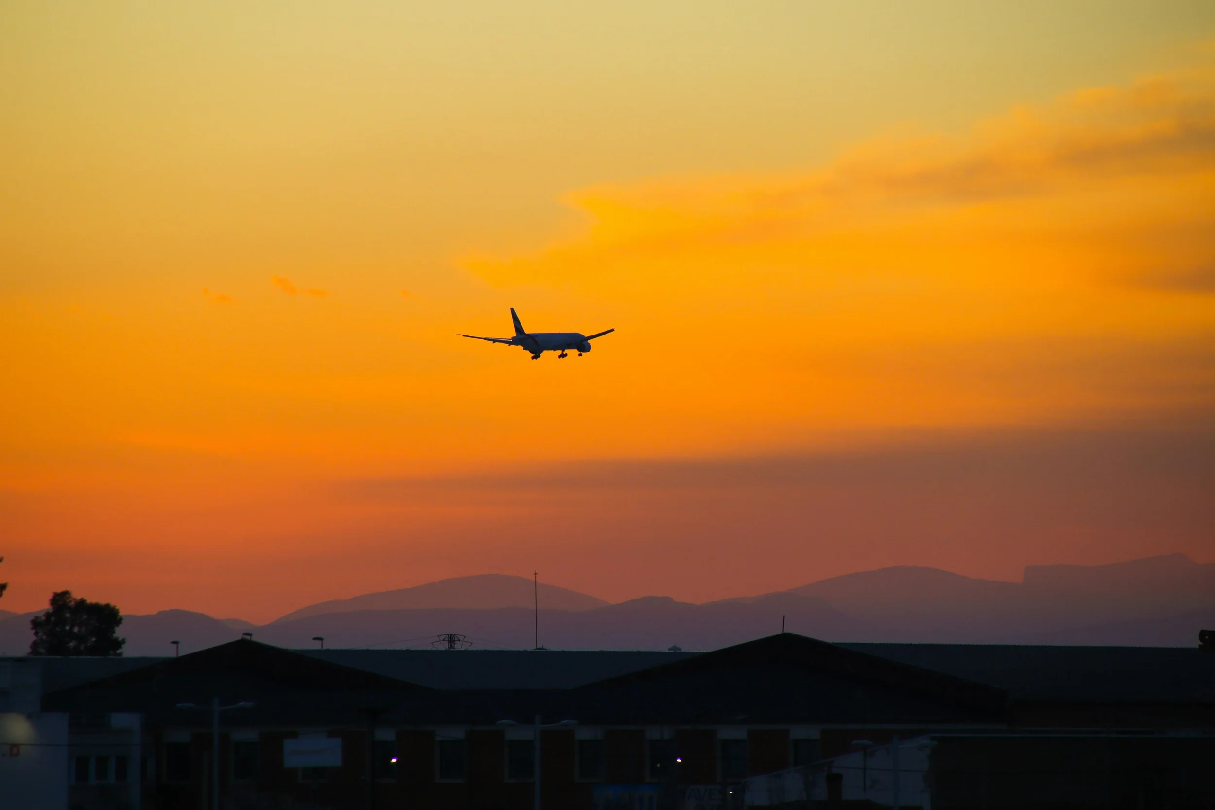 Commercial aircraft arriving in Jamaica at sunset where residual aircraft disinsection is required for all international arriving flights