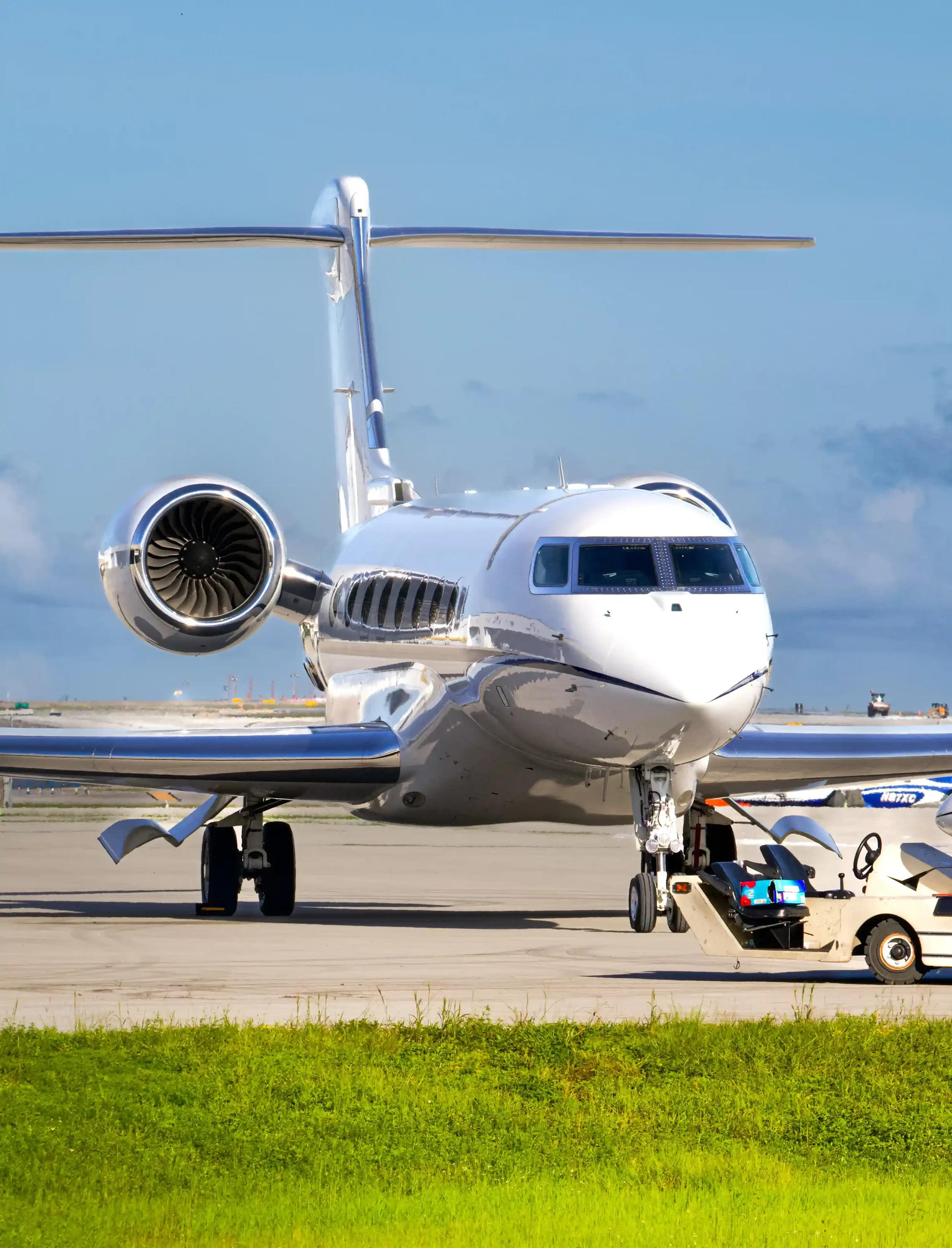 Large cabin business jet being positioned on airport ramp for residual aircraft disinsection before international departure