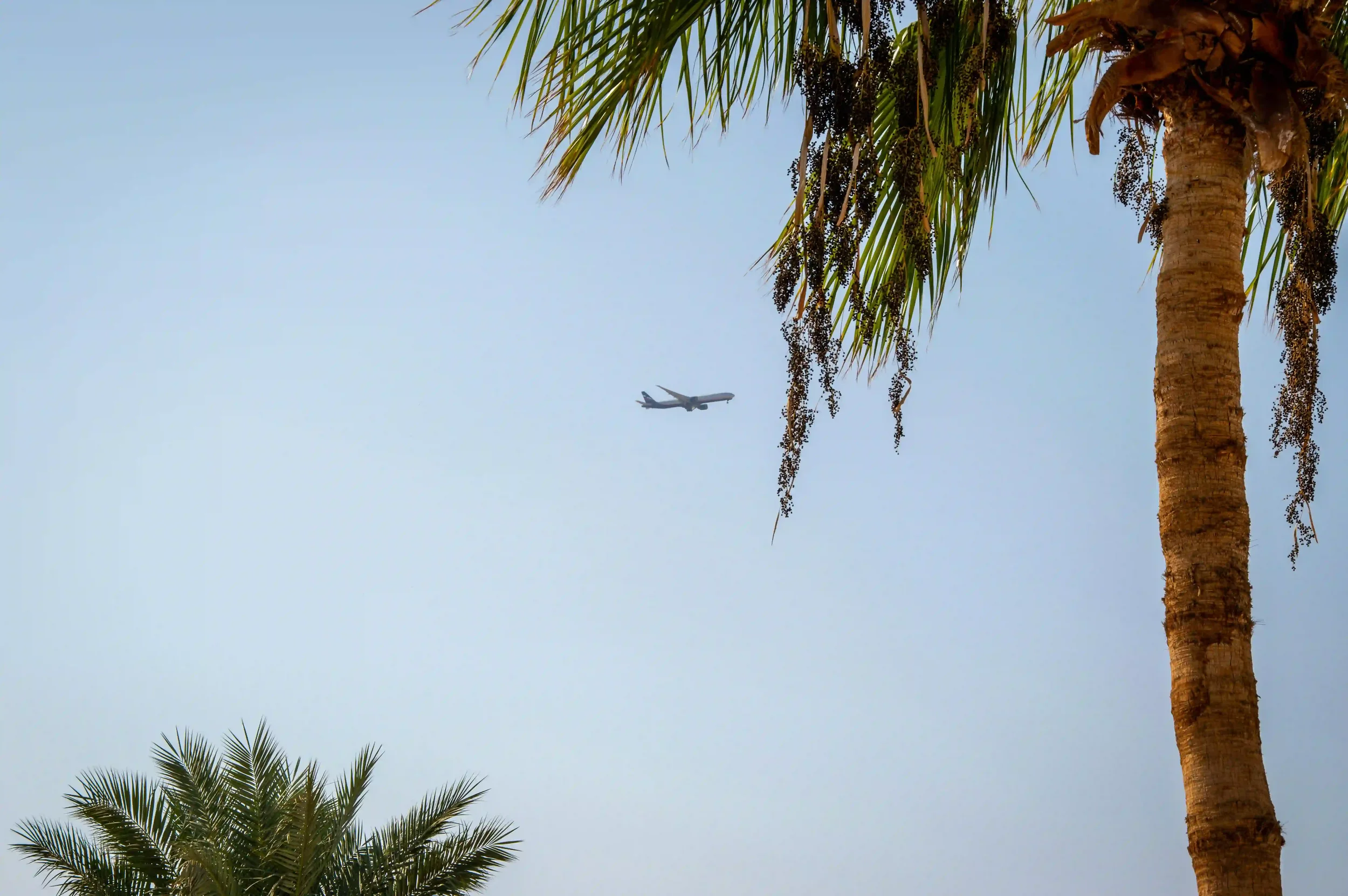 Commercial aircraft arriving over Cook Islands tropical destination where all international flights require aircraft disinsection