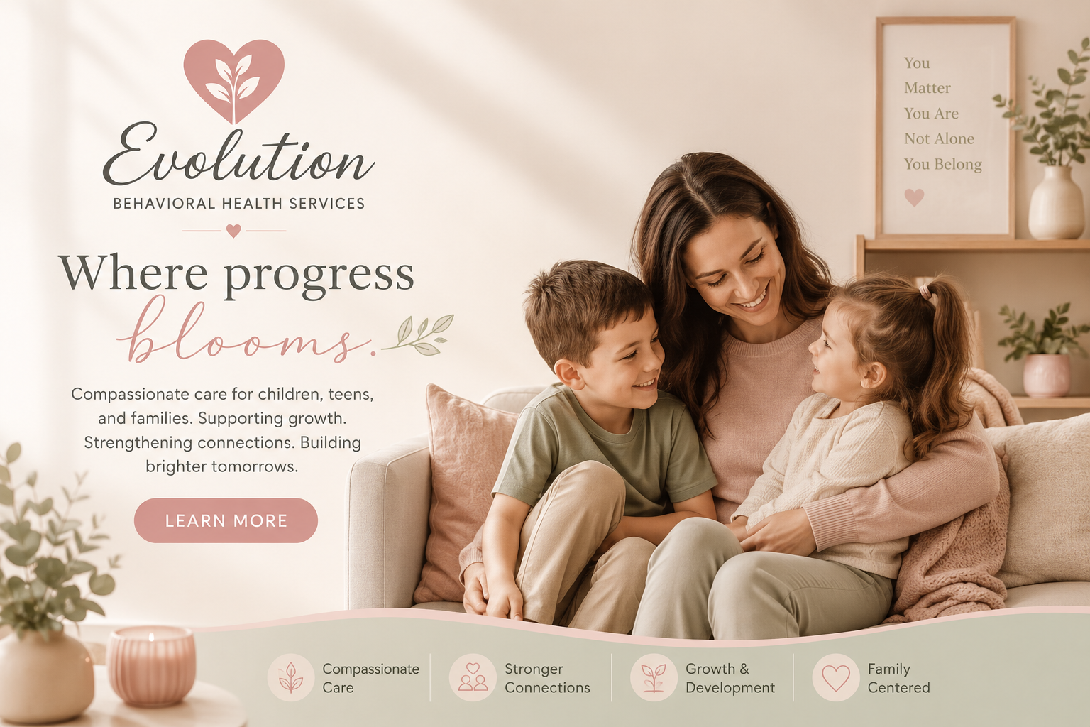A happy woman sitting on a beige couch with a young boy and girl, smiling and looking at each other, in a cozy, well-decorated room with houseplants and framed artwork.