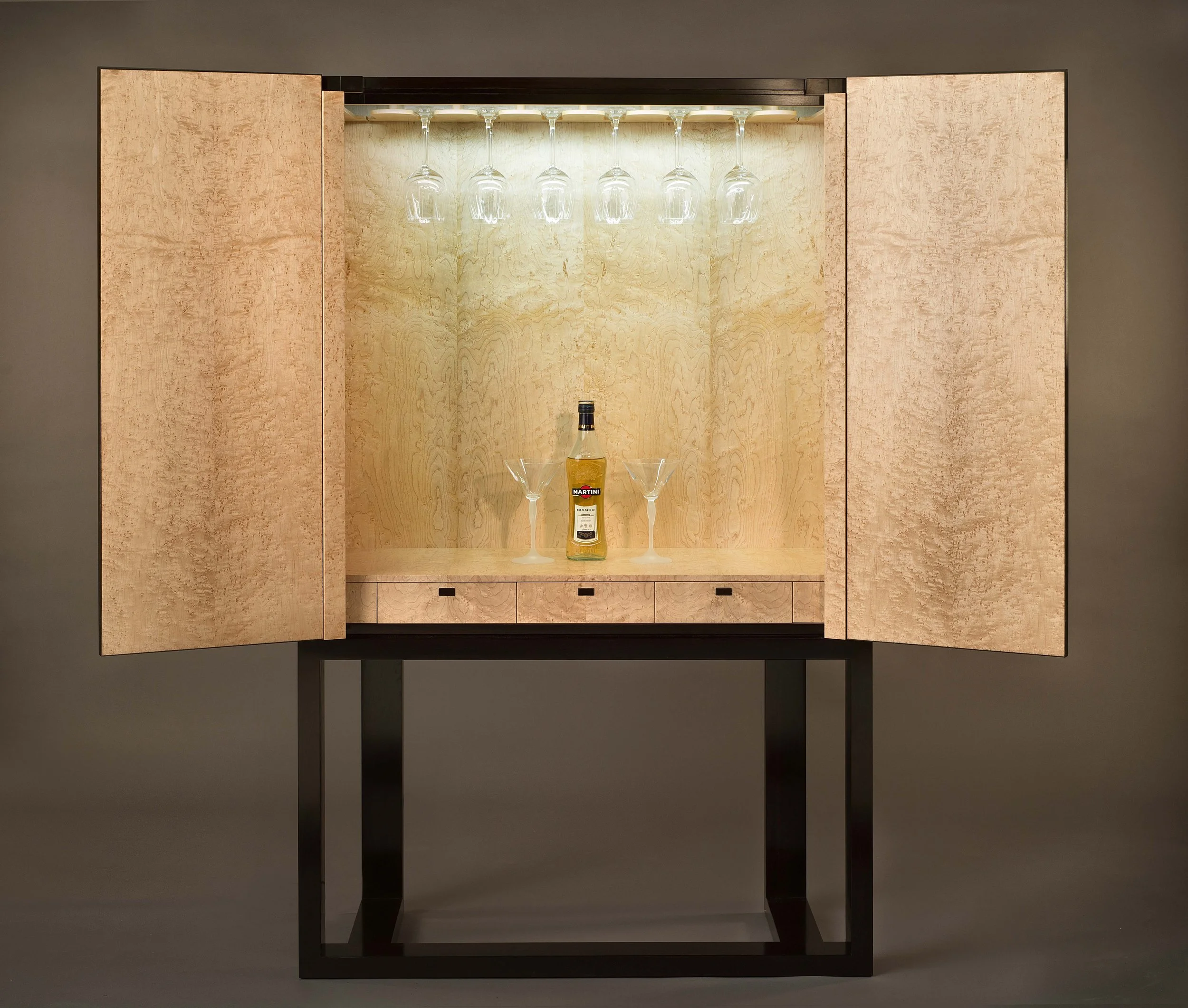 3. interior of the cabinet in birds eye maple.jpg