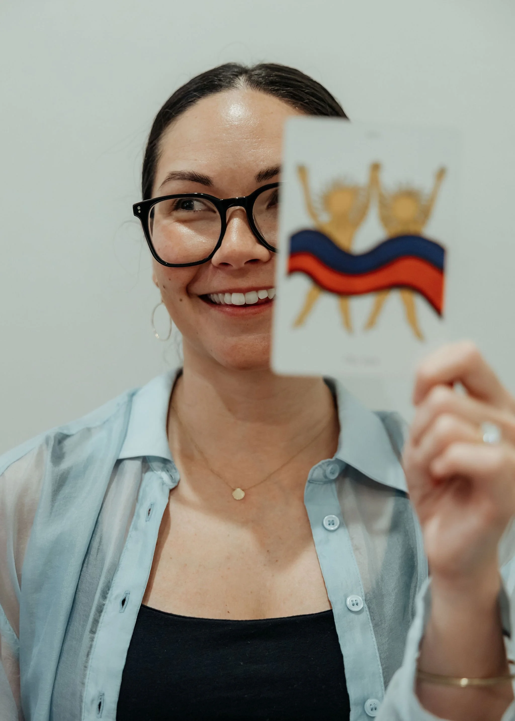 Portrait of woman holding tarot card