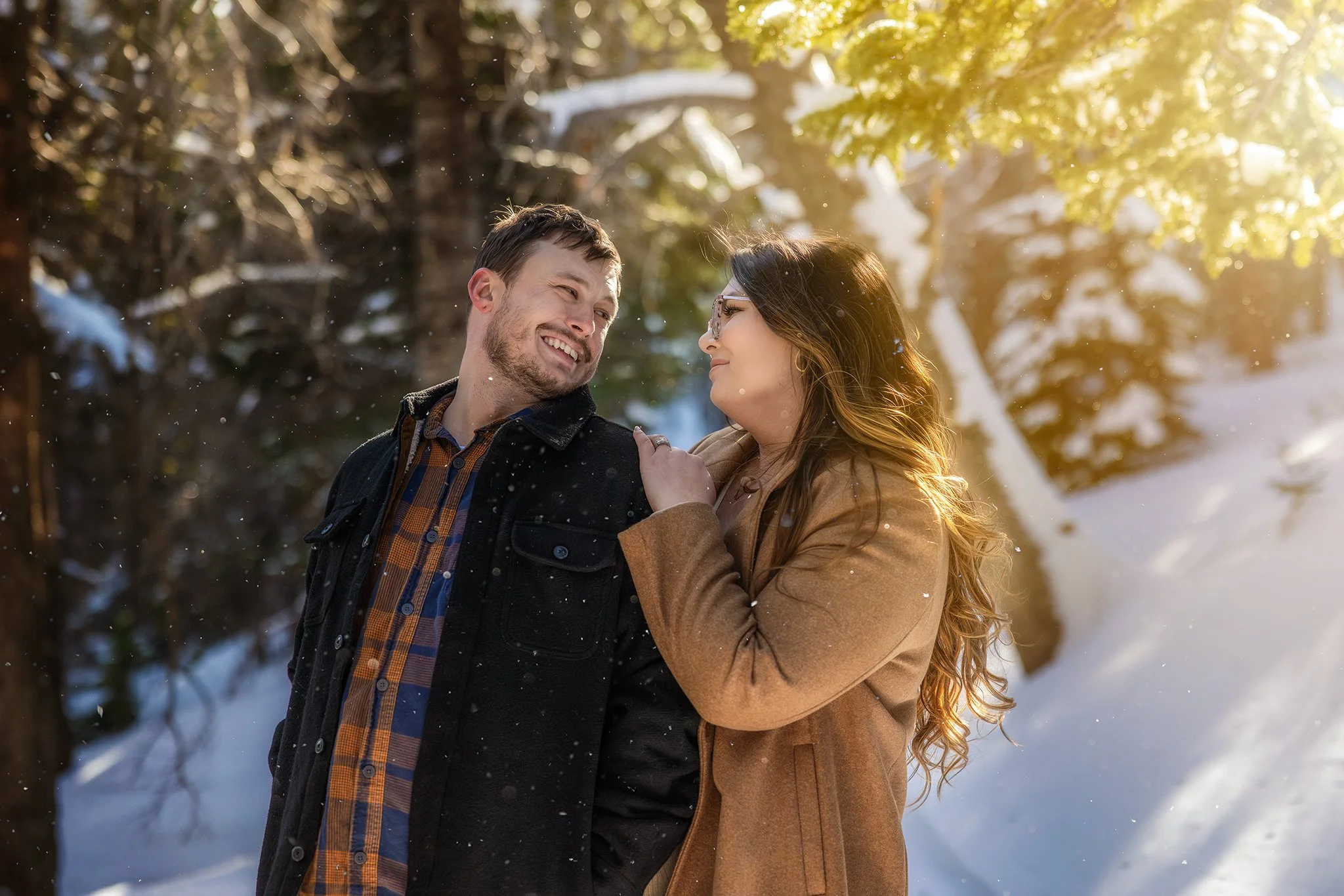 One of my favorites. It was harsh mid-day sun, but we used the trees to diffuse the sun, creating a mid-day Golden Hour. The wind blew the snow off the trees and created a whimsical composition.