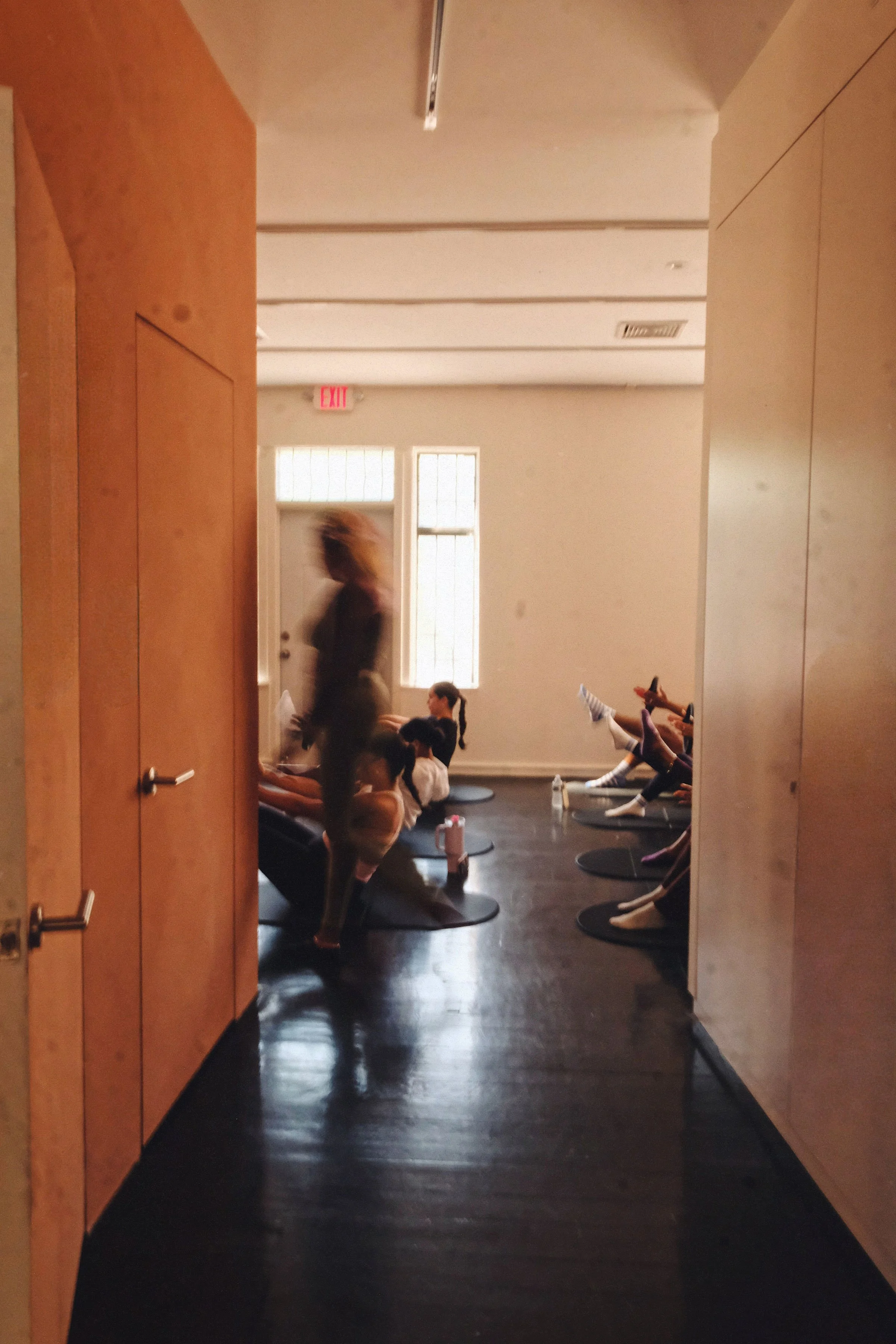 Woman teaching group pilates fitness class