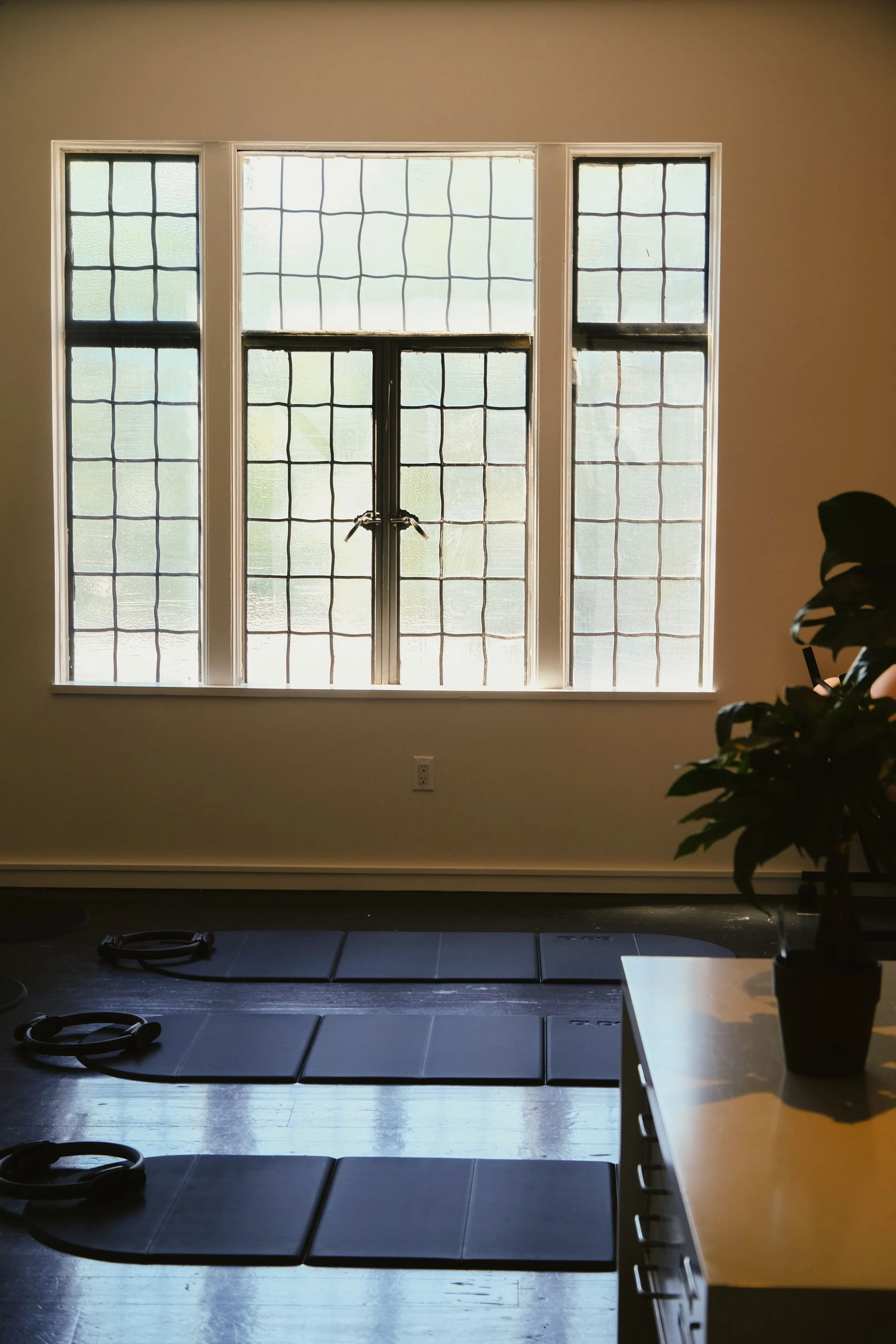 Pilates mats and equipment on studio floor