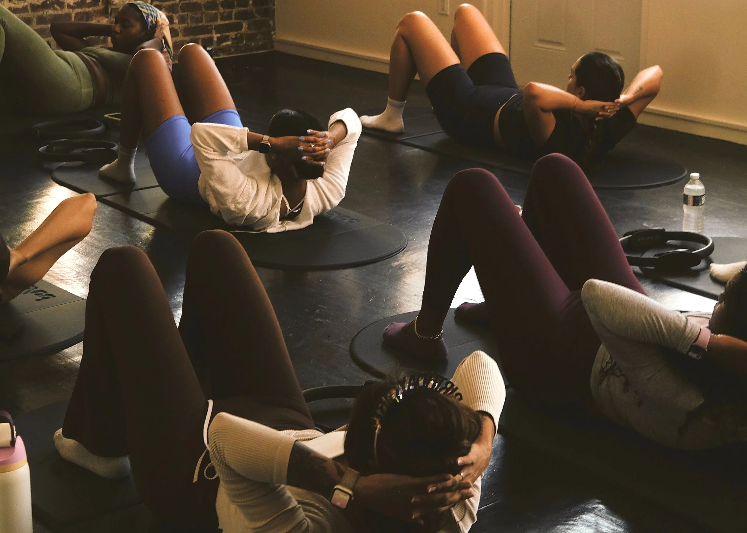 Mixed group pilates class fitness session