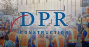 Group of construction workers wearing safety vests and helmets at a construction site