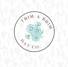 A logo for Trim A Brim Hat Co. features a circular design with a teal floral motif in the center and the company name around the circle, set against a light background with subtle floral patterns.