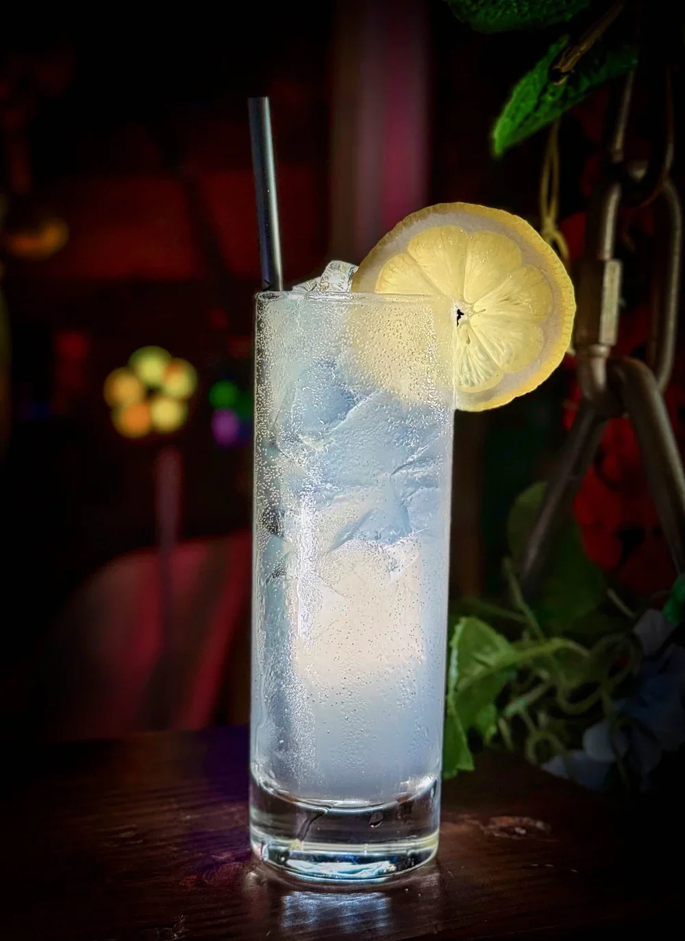Tall cocktail made with lemon and cucumber