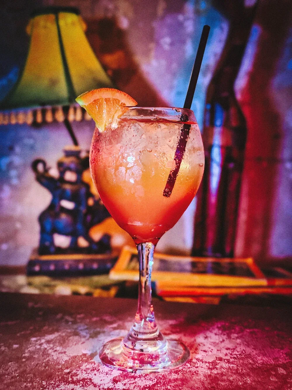 Aperol Spritz with an orange wedge.