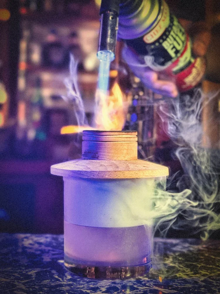 Fancy cocktail with a smoker.