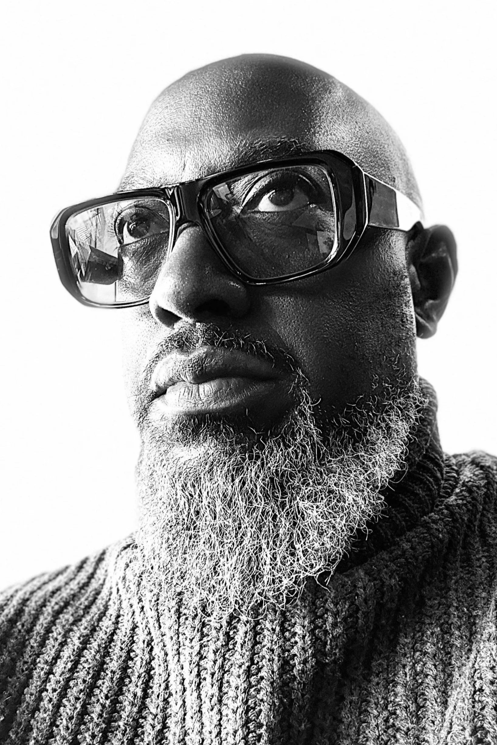 Close-up black and white photo of the artist, Mike Facey.