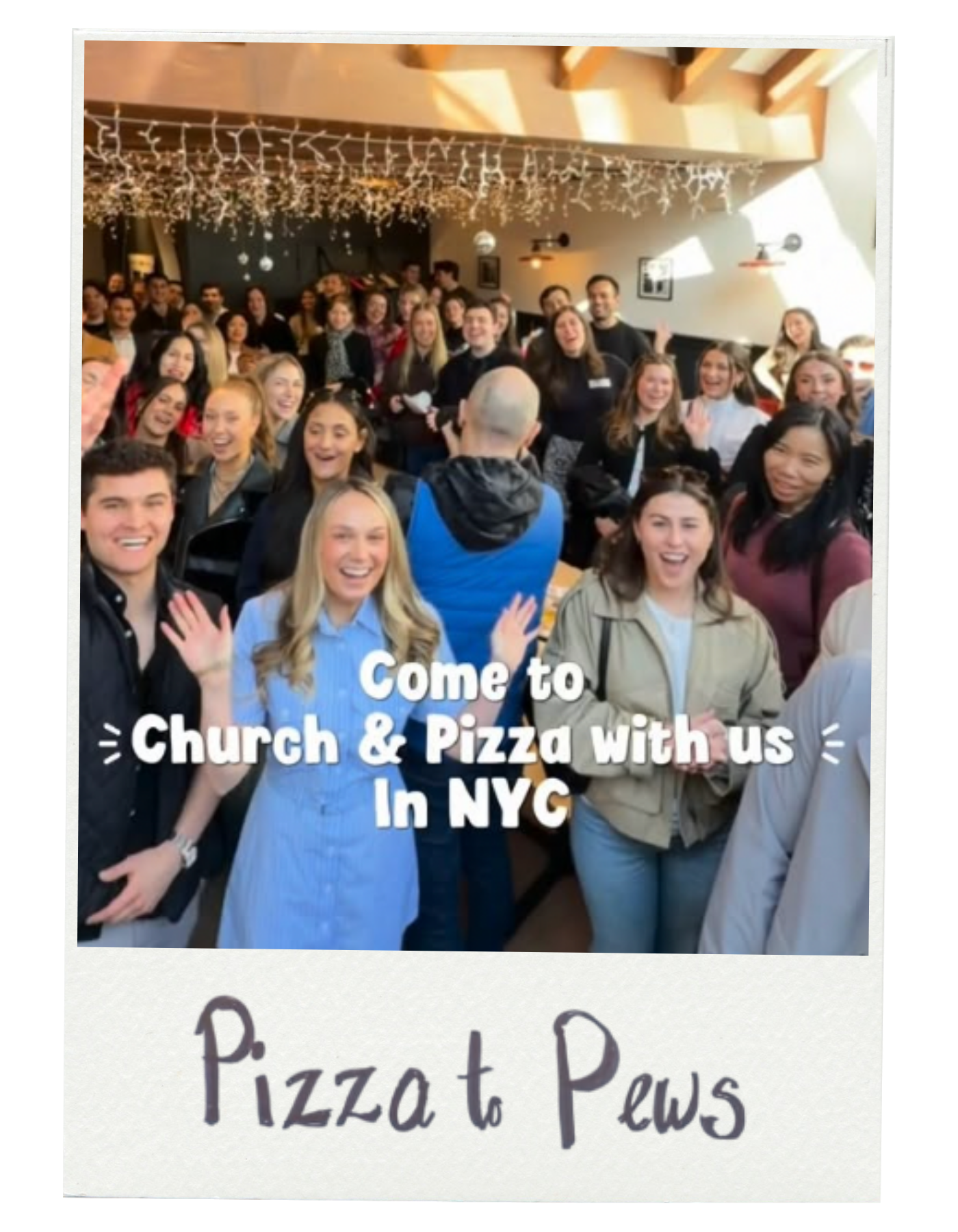 Group of smiling people at a gathering, with decorations hanging from the ceiling, promoting a church event that includes pizza in NYC.