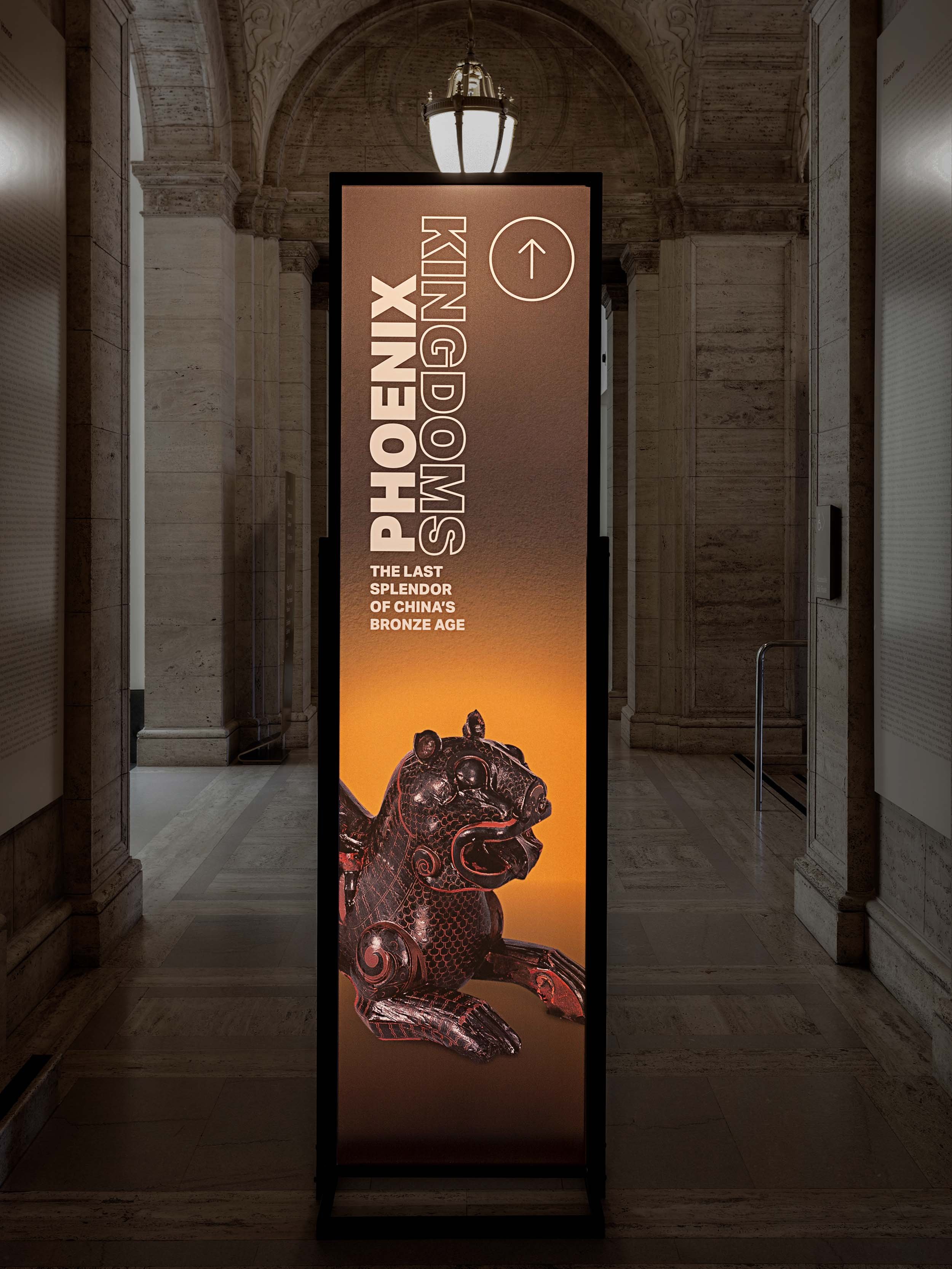 totem sign museum hallway directing foot traffic exhibition