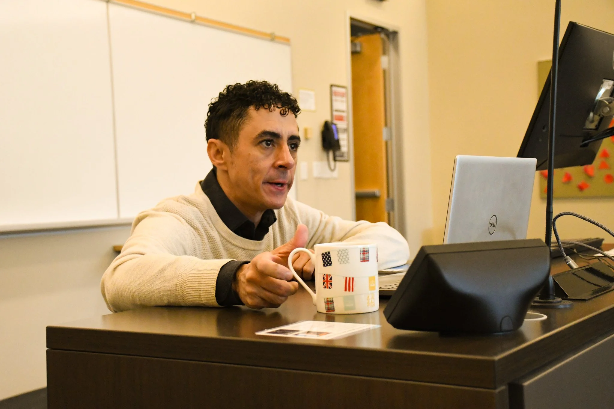 John Little working on a laptop preparing family coaching strategies